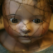 Photo of antique procelain doll wil cracks on face