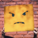 Hands holding an angry face sign