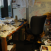 Cluttered desk and office space